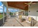Spacious covered patio with pool view and outdoor seating area at 10509 Broadland Pass, Thonotosassa, FL 33592