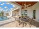 Relaxing pool area with a covered dining area and a bright open feel at 10509 Broadland Pass, Thonotosassa, FL 33592
