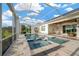 Sparkling pool with a screened enclosure and tiled patio at 10509 Broadland Pass, Thonotosassa, FL 33592