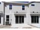 View of the backyard featuring a concrete patio and sliding glass doors, providing seamless indoor-outdoor living at 10708 Oak Bend Dr, Parrish, FL 34219