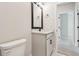 Bathroom with vanity, marble countertops, dark hardware, and toilet at 10708 Oak Bend Dr, Parrish, FL 34219