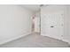 A bright bedroom with neutral carpet and a double door closet at 10708 Oak Bend Dr, Parrish, FL 34219