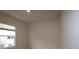 Bright bedroom with large window and neutral walls, awaiting your personal touch and design ideas at 10708 Oak Bend Dr, Parrish, FL 34219