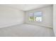 Bedroom with natural light and neutral colored carpet at 10708 Oak Bend Dr, Parrish, FL 34219