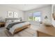 Bright bedroom features light wood accents, natural light, and neutral color palette at 10708 Oak Bend Dr, Parrish, FL 34219