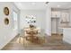 Cozy dining area with stylish decor, hardwood floors, and access to the kitchen at 10708 Oak Bend Dr, Parrish, FL 34219