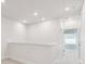 A bright hallway with a neutral carpet and natural light at 10708 Oak Bend Dr, Parrish, FL 34219