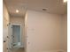 Hallway with neutral walls and carpet, and doors leading to bedrooms and other rooms at 10708 Oak Bend Dr, Parrish, FL 34219