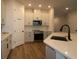 Modern kitchen featuring an island, stainless steel appliances, and white cabinetry at 10708 Oak Bend Dr, Parrish, FL 34219