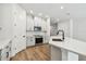 Bright kitchen with white cabinetry, stainless steel appliances, and quartz counters at 10708 Oak Bend Dr, Parrish, FL 34219