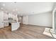 Bright kitchen open to the great room features white cabinetry and stainless steel appliances at 10708 Oak Bend Dr, Parrish, FL 34219