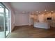 Open-concept living space connecting the kitchen and dining areas with great natural light at 10708 Oak Bend Dr, Parrish, FL 34219