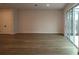 Bright living room with wood flooring and a sliding glass door that leads to a patio at 10708 Oak Bend Dr, Parrish, FL 34219