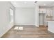 Bright living room featuring wood floors and lots of natural light at 10708 Oak Bend Dr, Parrish, FL 34219