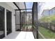 Enclosed patio area that includes a wall mounted light, offering an outdoor area and shade at 10708 Oak Bend Dr, Parrish, FL 34219