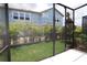 Relaxing screened patio provides a seamless indoor-outdoor transition and a calming view of the green yard at 10708 Oak Bend Dr, Parrish, FL 34219