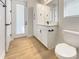 Modern bathroom features a cabinet, drawers, and a door to the outside at 11443 Apple Tree Cir, Bradenton, FL 34211
