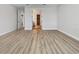 Neutral bedroom with wood floors, base-molding, and access to other rooms in home at 11443 Apple Tree Cir, Bradenton, FL 34211
