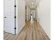 Hallway with wood flooring at 11443 Apple Tree Cir, Bradenton, FL 34211