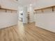 View of a walk-in closet and open door leading to a bright bathroom with a dual sink vanity at 11443 Apple Tree Cir, Bradenton, FL 34211
