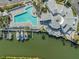 Aerial view featuring community marina, boat docks, and a pool perfect for recreational boating and swimming at 11450 Harbor Way # 5008, Largo, FL 33774