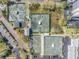 Overhead shot of tennis courts with mature landscaping and parking nearby at 11450 Harbor Way # 5008, Largo, FL 33774