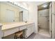 Bathroom featuring a spacious vanity with ample counter space, neutral walls, and tile flooring at 11450 Harbor Way # 5008, Largo, FL 33774