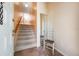 Inviting entryway with carpeted stairs, tile floor, coat closet and stairway at 11450 Harbor Way # 5008, Largo, FL 33774
