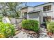 Charming townhouse with lovely landscaping around front entry and stairs at 11450 Harbor Way # 5008, Largo, FL 33774