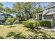 Charming home featuring a well-manicured front yard with a pond and fountain at 11450 Harbor Way # 5008, Largo, FL 33774