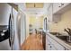 Kitchen with stainless steel refrigerator, white cabinets, and breakfast nook at 11450 Harbor Way # 5008, Largo, FL 33774
