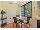 Cozy breakfast nook with a table and chairs, bathed in natural light from a window at 11450 Harbor Way # 5008, Largo, FL 33774