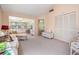 Spacious living area featuring bright lighting, comfortable seating, and access to other rooms at 11450 Harbor Way # 5008, Largo, FL 33774