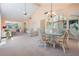 Open-concept living and dining area with vaulted ceiling, and comfortable seating at 11450 Harbor Way # 5008, Largo, FL 33774