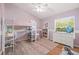 Cozy bedroom with a lofted bed, desk, and ample storage, perfect for a personal space at 1220 Darlington Oak Ne Cir, St Petersburg, FL 33703