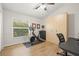 Bedroom with modern decor, a large window and stylish wooden floors at 1220 Darlington Oak Ne Cir, St Petersburg, FL 33703