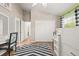 Charming bedroom featuring a white desk, wardrobe, and a bright window at 1220 Darlington Oak Ne Cir, St Petersburg, FL 33703
