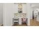 Cozy desk area with custom floral wallpaper and built-in shelving perfect for a home office or study space at 1220 Darlington Oak Ne Cir, St Petersburg, FL 33703
