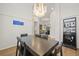 Elegant dining room featuring a modern chandelier, large table, and open floor plan at 1220 Darlington Oak Ne Cir, St Petersburg, FL 33703