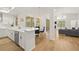 Bright, open-concept kitchen with quartz countertops, stainless steel appliances, and seamless flow to living spaces at 1220 Darlington Oak Ne Cir, St Petersburg, FL 33703