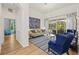 Elegant living room showcases stylish decor, hardwood floors, and seamless transition to the outdoor living space at 1220 Darlington Oak Ne Cir, St Petersburg, FL 33703
