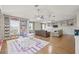 Spacious living area with hardwood floors, ceiling fans, and custom built-in bookshelves at 1220 Darlington Oak Ne Cir, St Petersburg, FL 33703