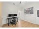 Bright office space with modern desk setup and a large London-themed wall art at 1220 Darlington Oak Ne Cir, St Petersburg, FL 33703