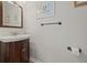 Charming powder room with wood vanity, classic fixtures, and stylish wall decor for added character at 1220 Darlington Oak Ne Cir, St Petersburg, FL 33703