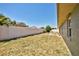Exterior backyard view featuring a white fence, patio set, and dry grass lawn at 12532 115Th St, Largo, FL 33778