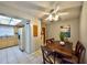Charming dining area with a view of the kitchen, featuring a wooden table and comfortable seating at 12532 115Th St, Largo, FL 33778
