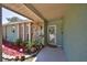 The home's front entrance features a decorated screen door and a covered porch at 12532 115Th St, Largo, FL 33778