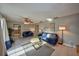 Bright living room with gray walls, tile flooring, and views into the dining area and kitchen at 12532 115Th St, Largo, FL 33778