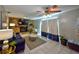 Comfortable living room with a fireplace, ceiling fan, and sliding doors, perfect for relaxing and entertaining at 12532 115Th St, Largo, FL 33778