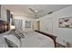 Relaxing main bedroom with a plush bed, stylish decor, and a ceiling fan for added comfort is a cozy retreat at 12532 115Th St, Largo, FL 33778